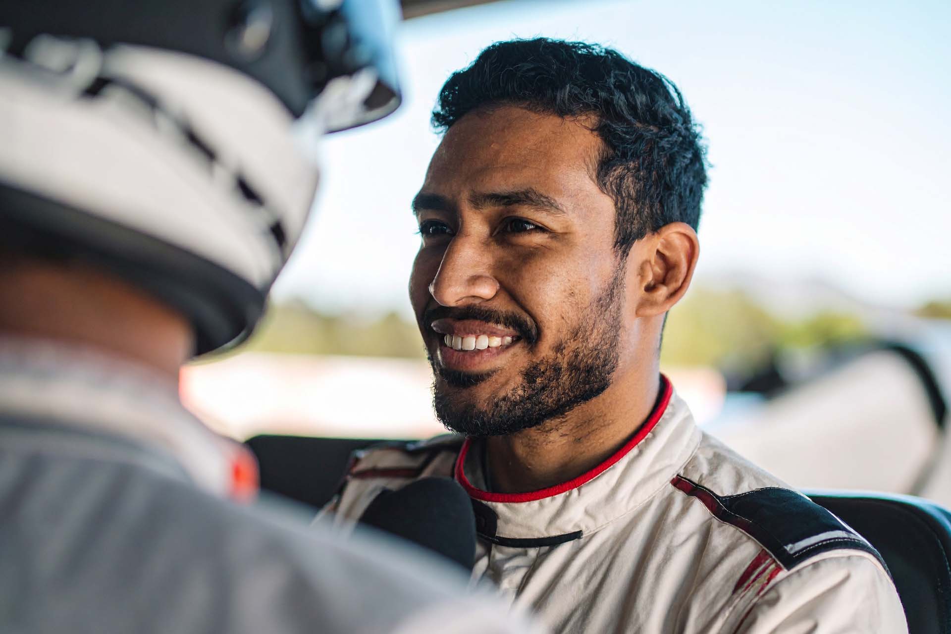 Public Relations and Copywriting 4 Pole motorsport PR brand racing driver celebrating a win.