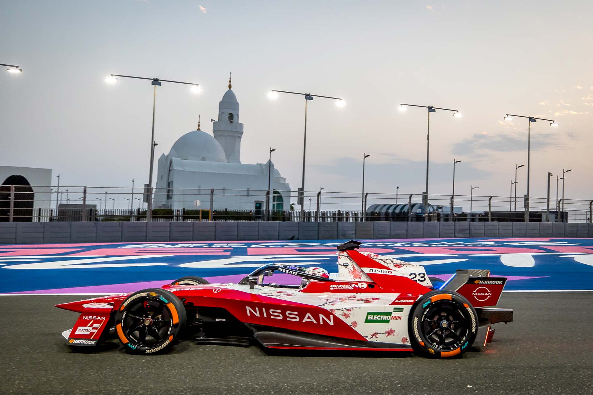 Public Relations and Copywriting 1 Nissan Formula E racing car on the track.
